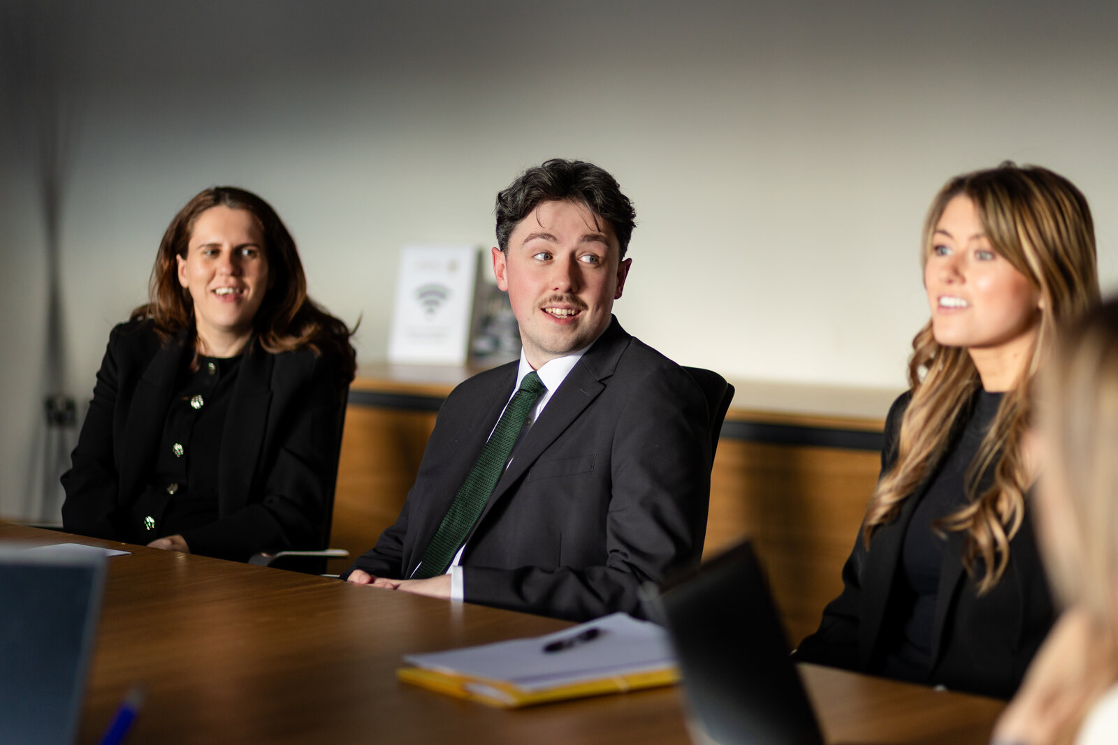 NIYSA committee members in a professional boardroom meeting